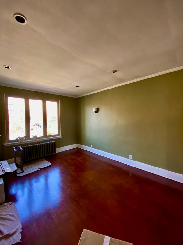 169-10 29th Avenue Queens, NY 11358 - Photo 2 of 10 a view of room with window and wooden floor