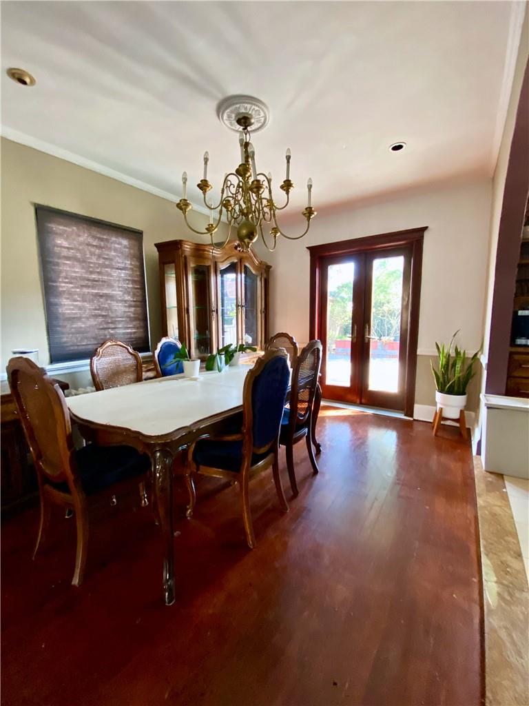 169-10 29th Avenue Queens, NY 11358 - Photo 3 of 10 a view of a dining room with furniture and wooden floor