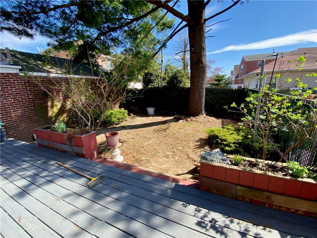 169-10 29th Avenue Queens, NY 11358 - Photo 9 of 10 a view of a bench in a yard