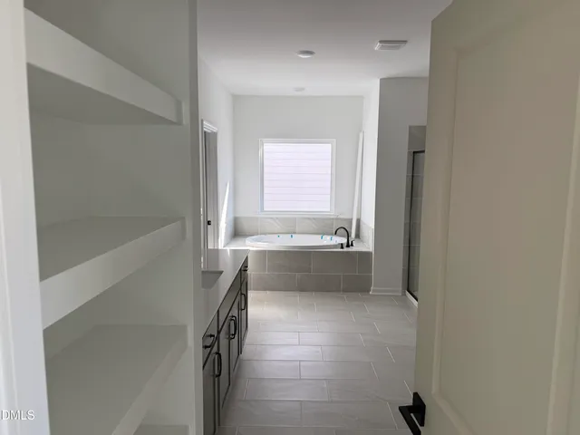 a bathroom with a sink and a large mirror