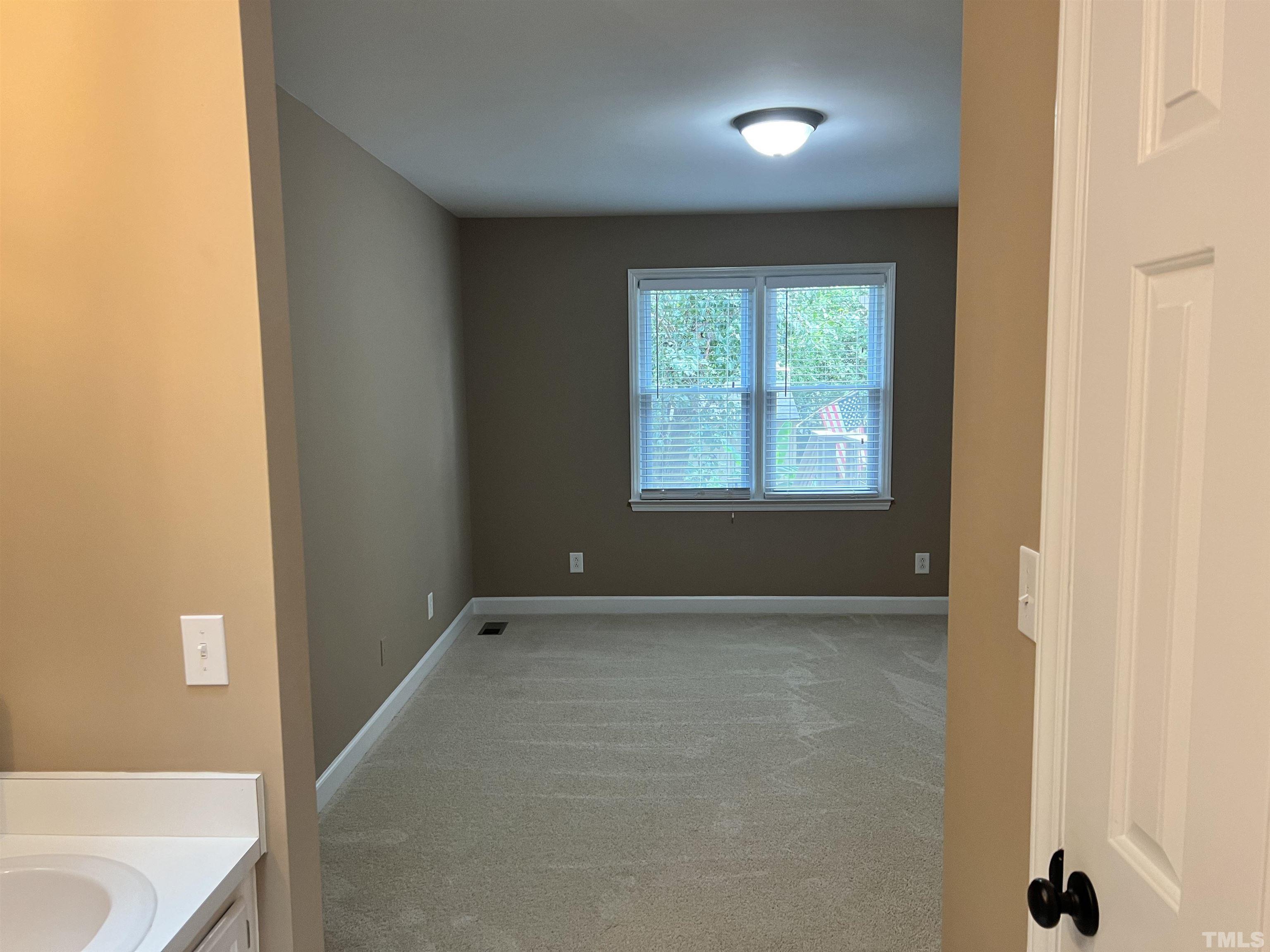 5612 Spring Pines Way Raleigh, NC 27616 - Photo 13 of 31 a view of an empty room with a window