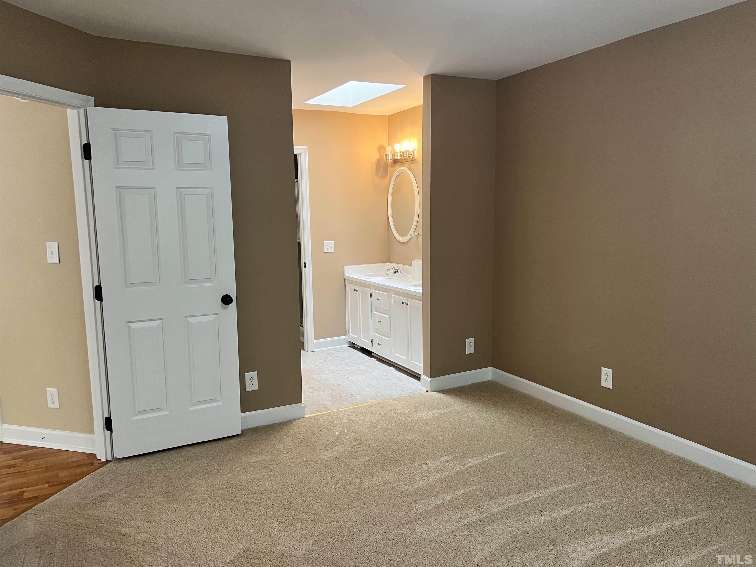 5612 Spring Pines Way Raleigh, NC 27616 - Photo 14 of 31 an empty room with a door