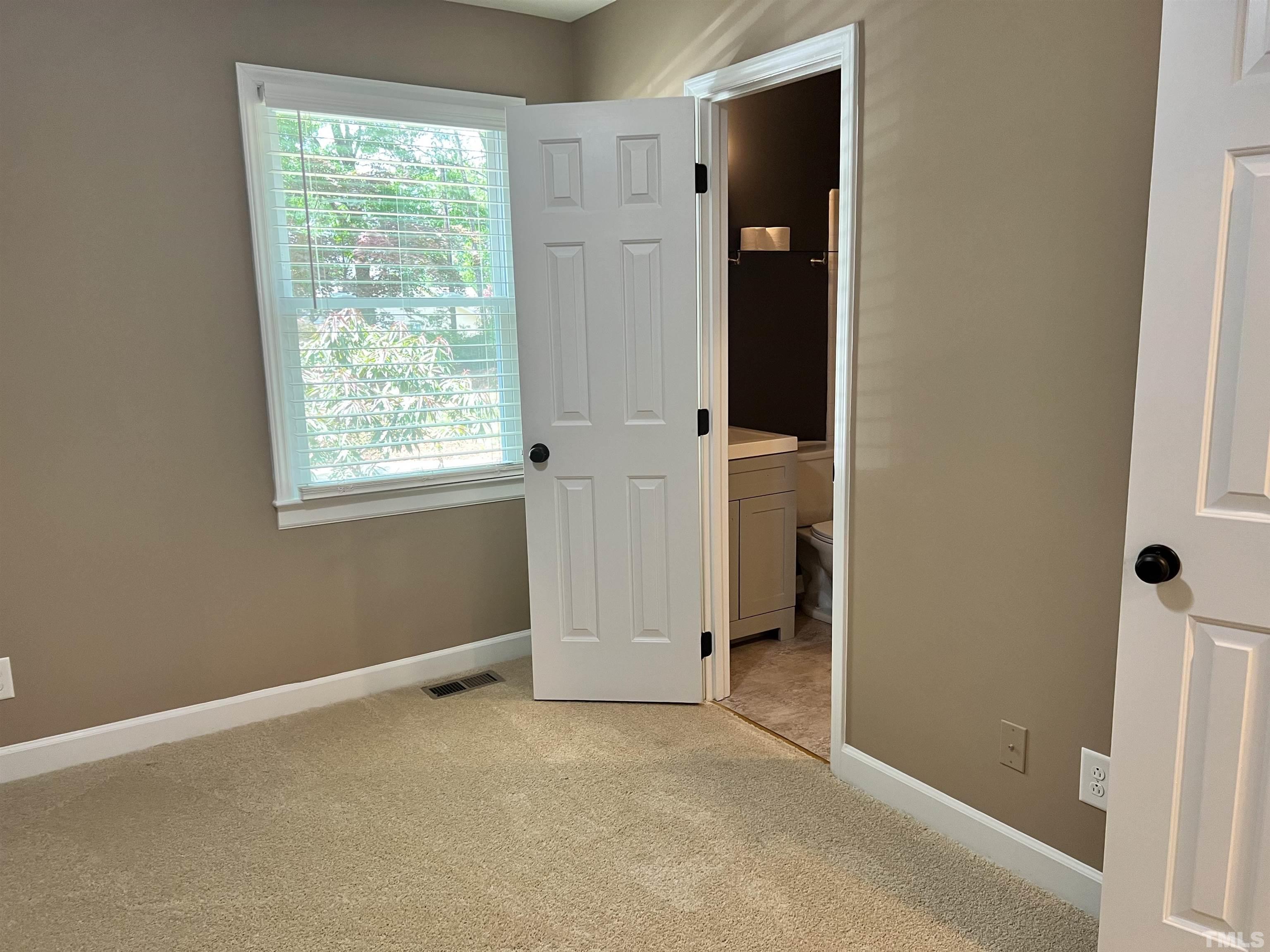 5612 Spring Pines Way Raleigh, NC 27616 - Photo 16 of 31 an empty room with windows and closet