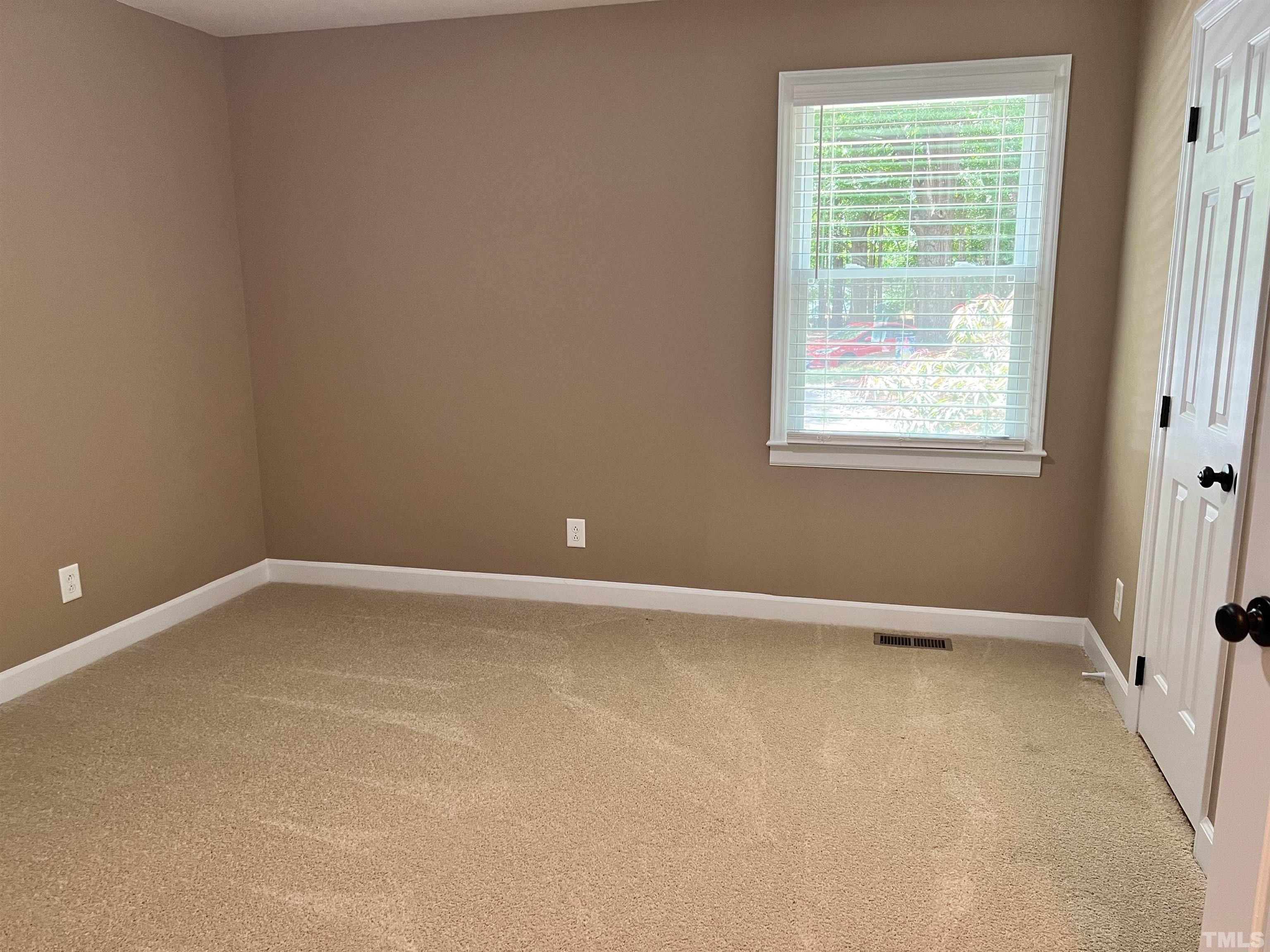 5612 Spring Pines Way Raleigh, NC 27616 - Photo 17 of 31 an empty room with a window