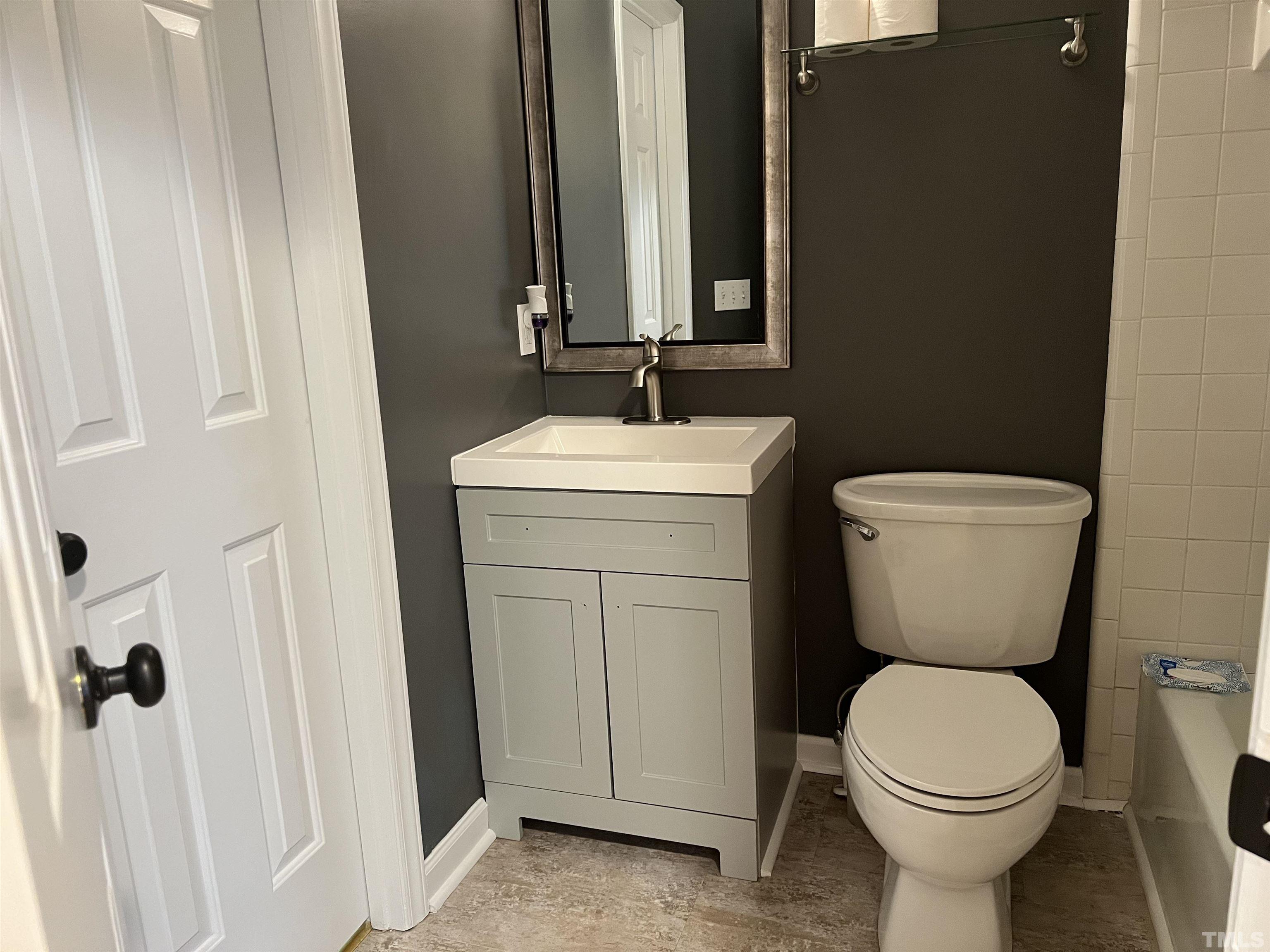 5612 Spring Pines Way Raleigh, NC 27616 - Photo 18 of 31 a bathroom with a toilet sink and mirror