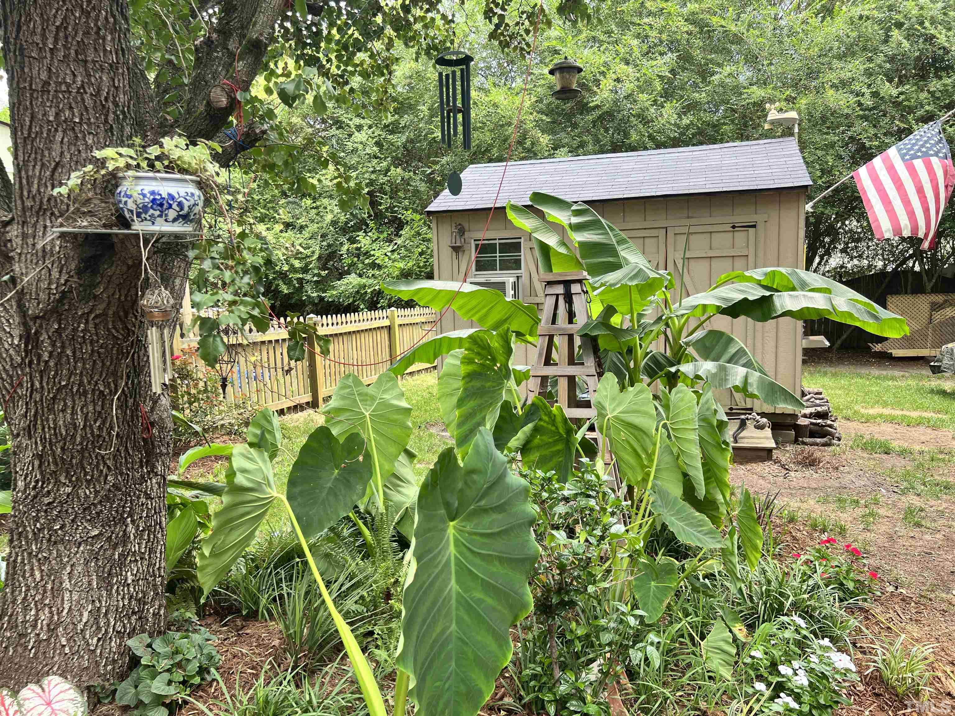 5612 Spring Pines Way Raleigh, NC 27616 - Photo 21 of 31 a backyard of a house with lots of green space