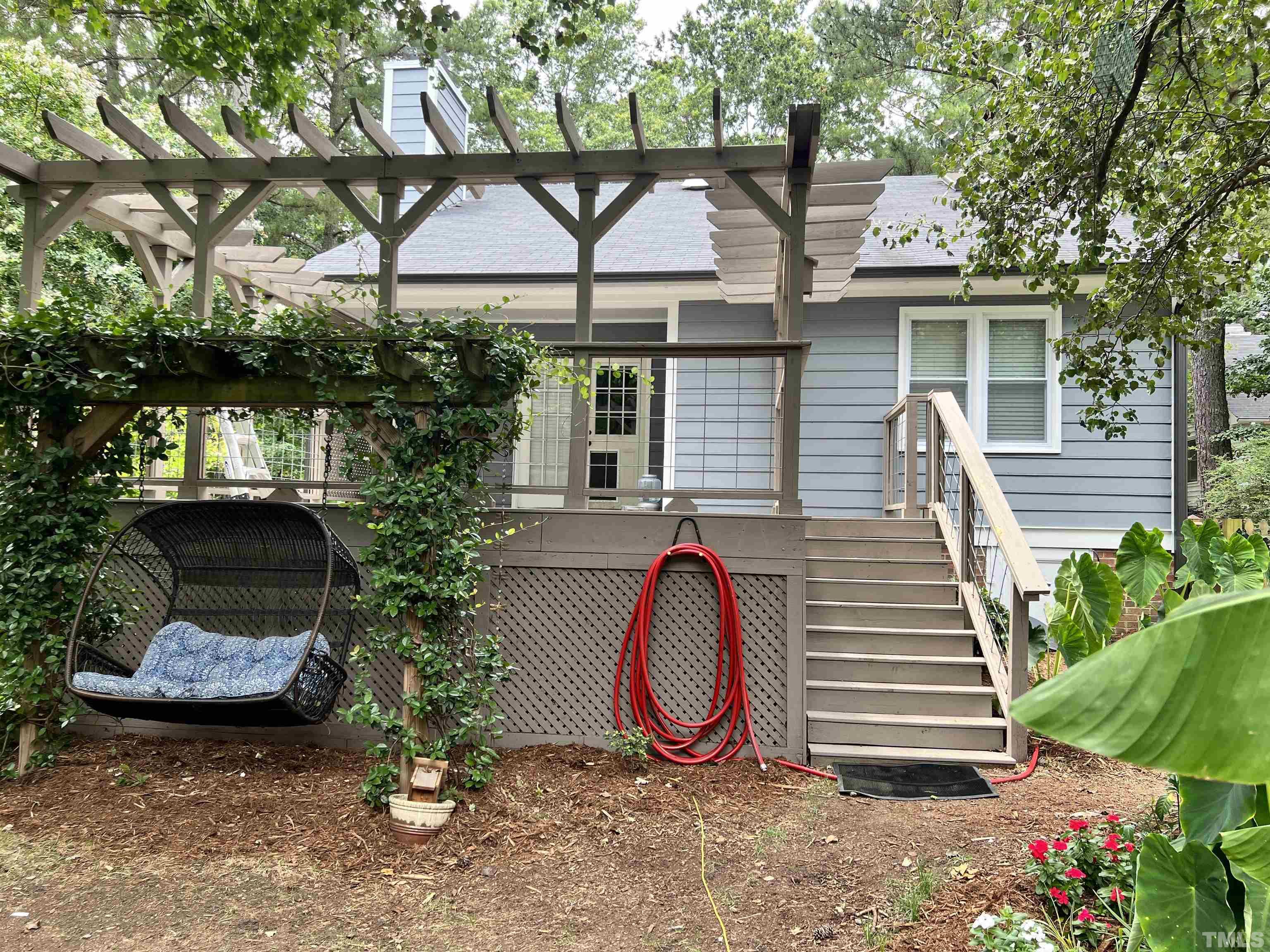5612 Spring Pines Way Raleigh, NC 27616 - Photo 25 of 31 a view of a house with backyard and a garden