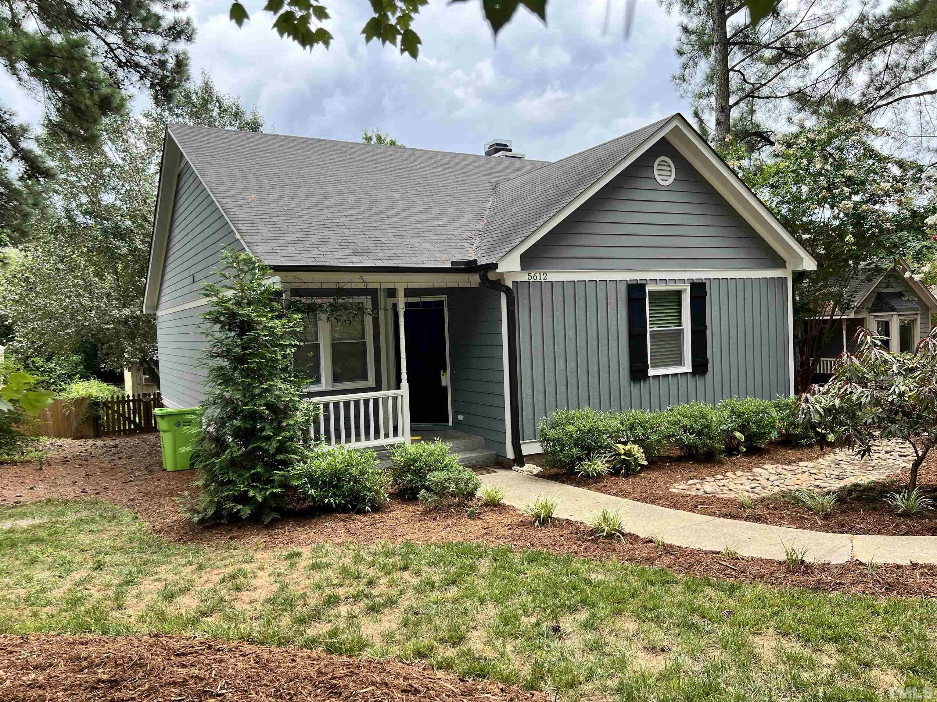 5612 Spring Pines Way Raleigh, NC 27616 - Photo 27 of 31 a front view of a house with garden
