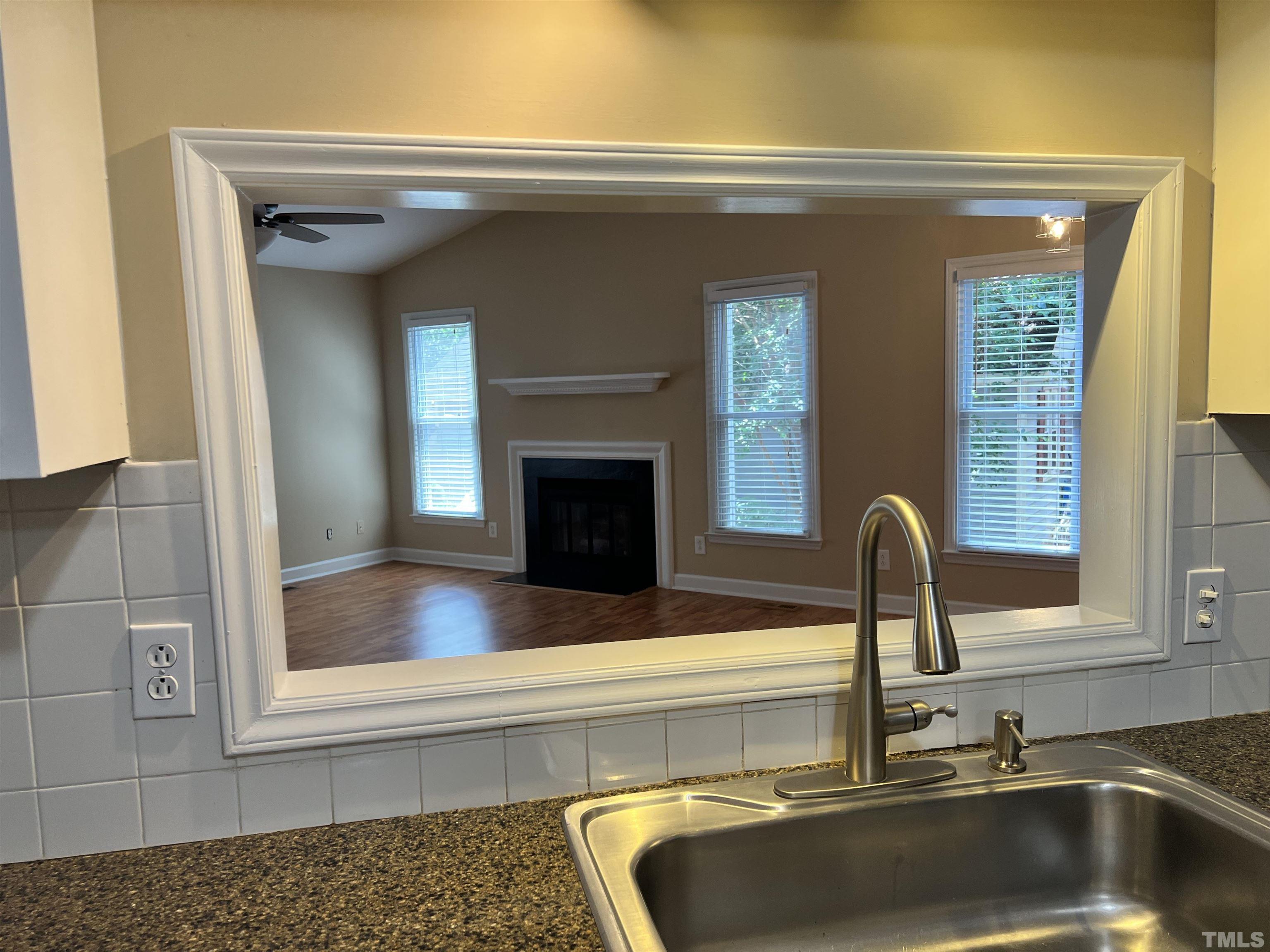 5612 Spring Pines Way Raleigh, NC 27616 - Photo 7 of 31 a kitchen with a sink and a window