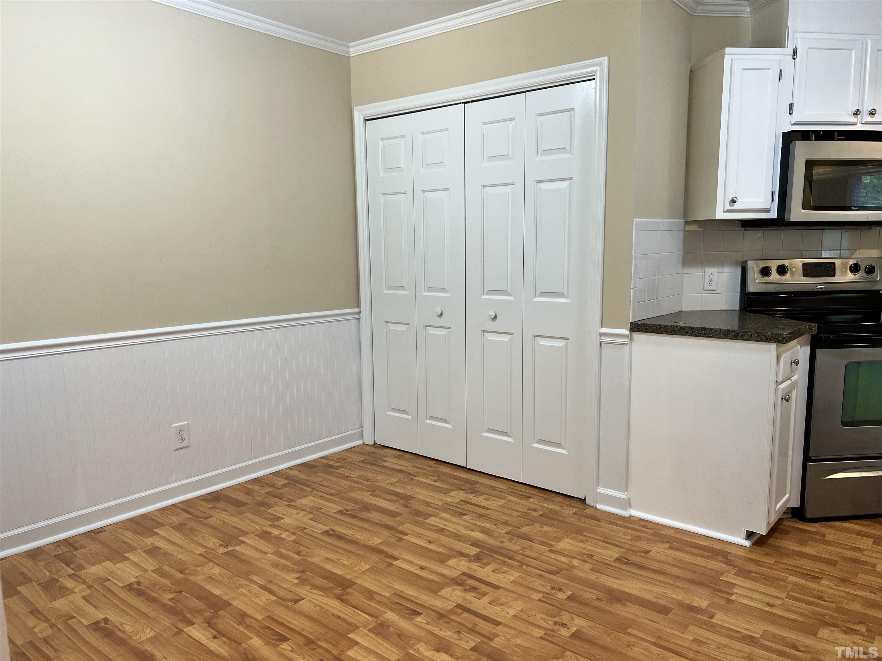 5612 Spring Pines Way Raleigh, NC 27616 - Photo 9 of 31 a view of a kitchen with microwave and cabinets