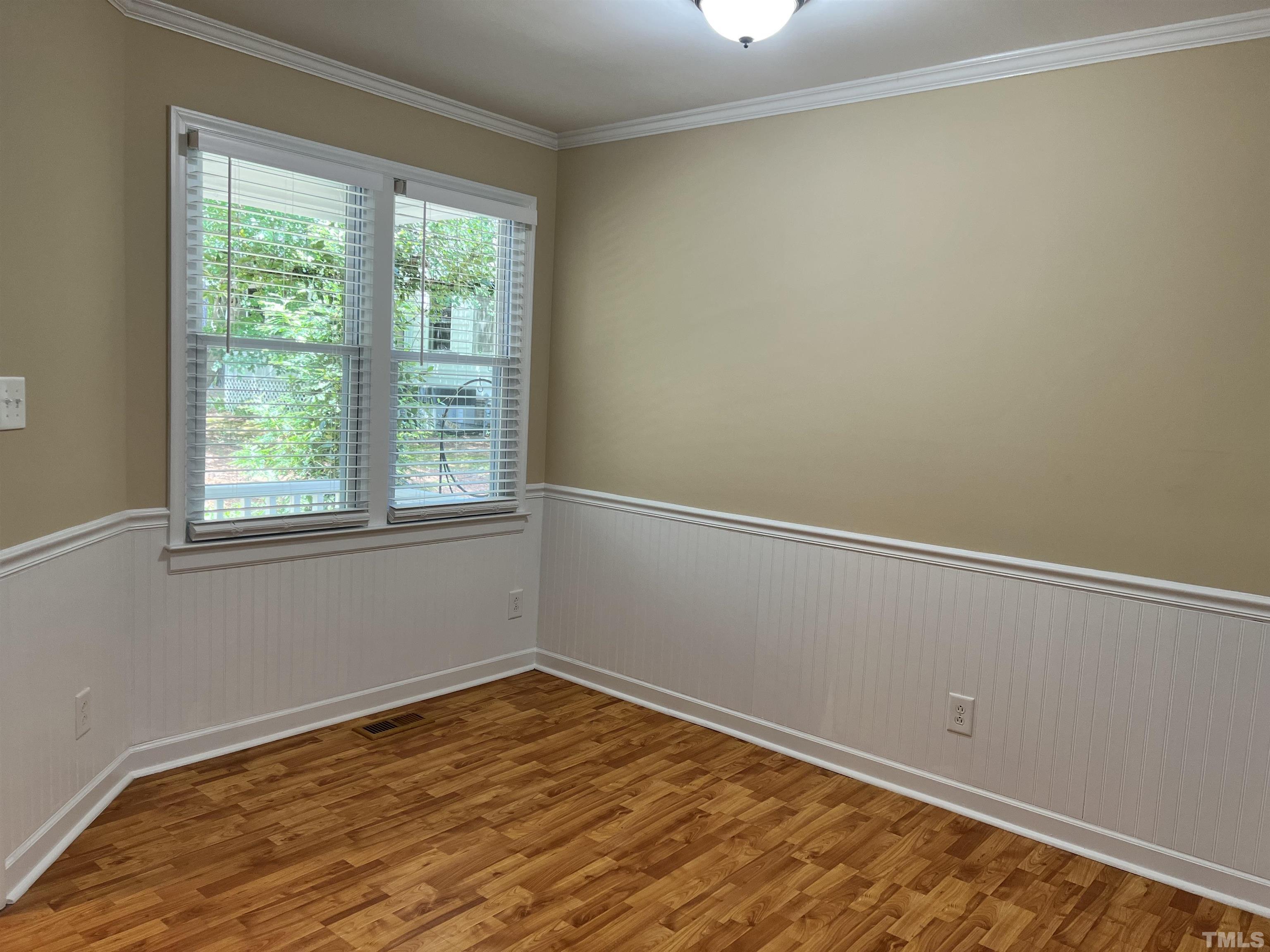 5612 Spring Pines Way Raleigh, NC 27616 - Photo 10 of 31 a view of a room with wooden floor and natural light