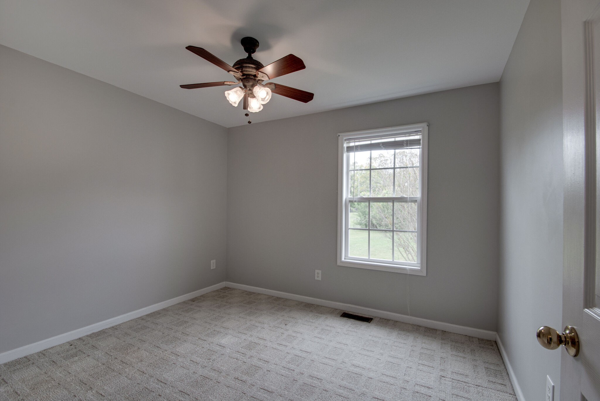 166 Caldwell Road Summertown, TN 38483 - Photo 14 of 36 an empty room with windows and fan
