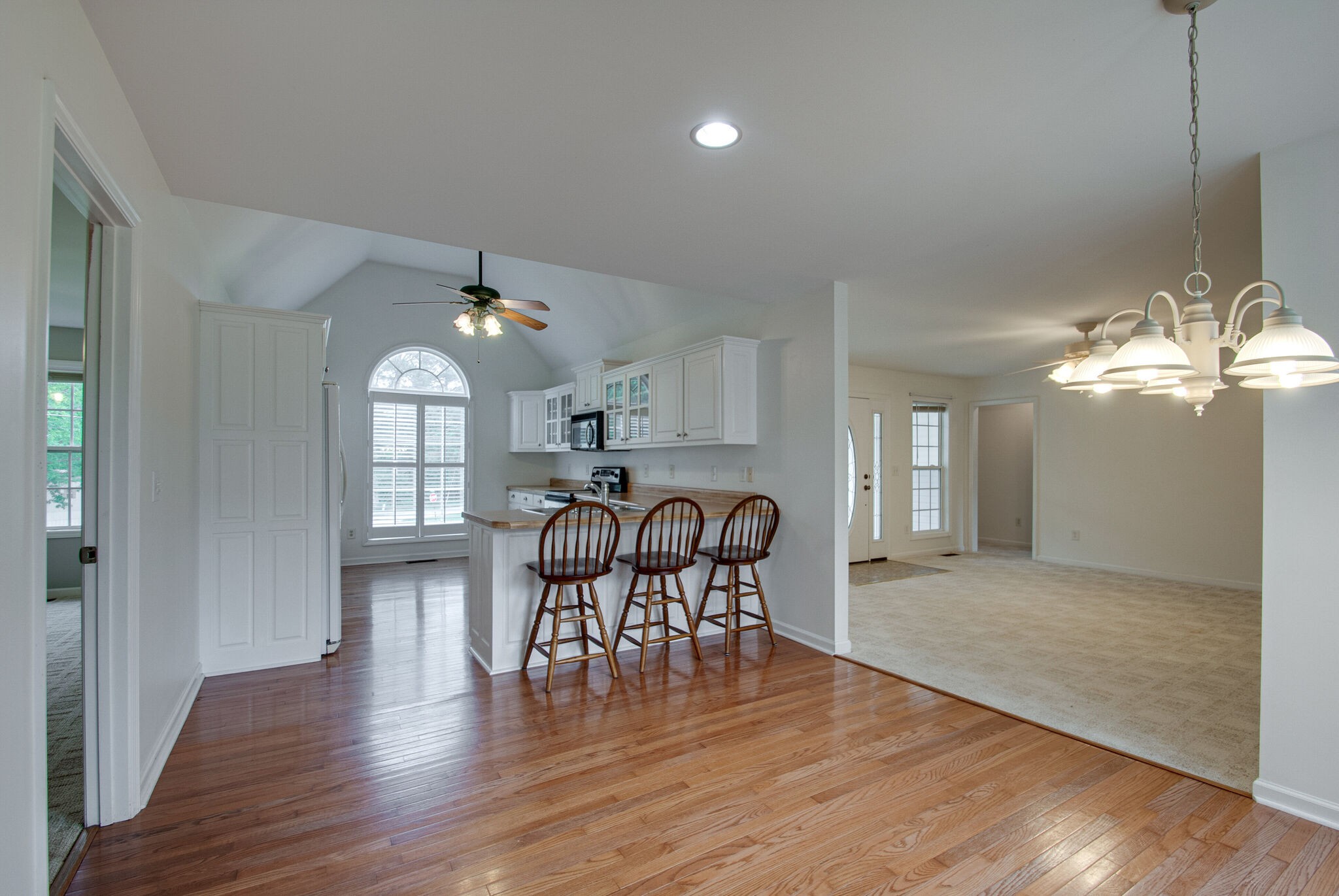 166 Caldwell Road Summertown, TN 38483 - Photo 17 of 36 a dining room with furniture a chandelier and wooden floor
