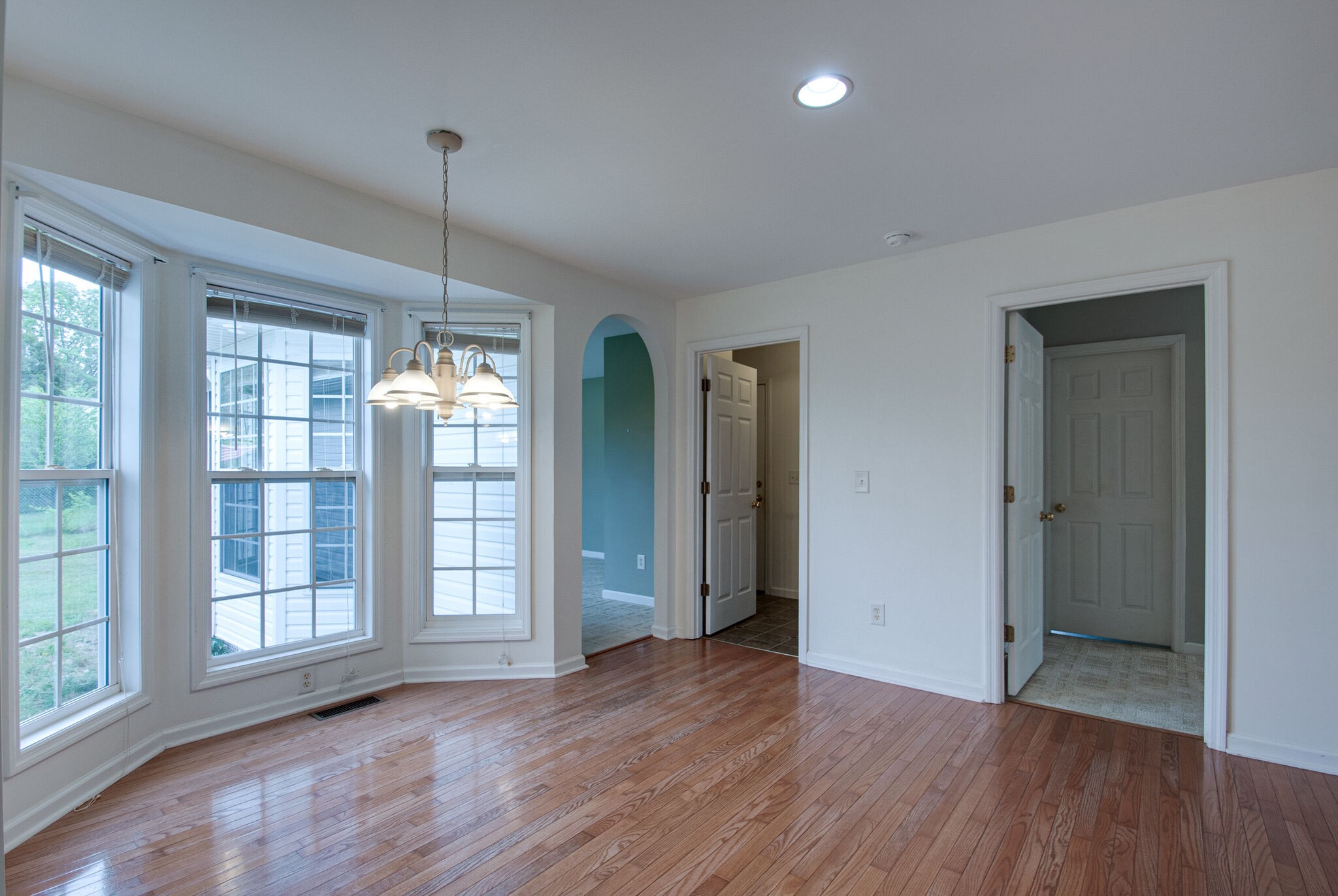 166 Caldwell Road Summertown, TN 38483 - Photo 18 of 36 a view of an empty room with wooden floor and a window