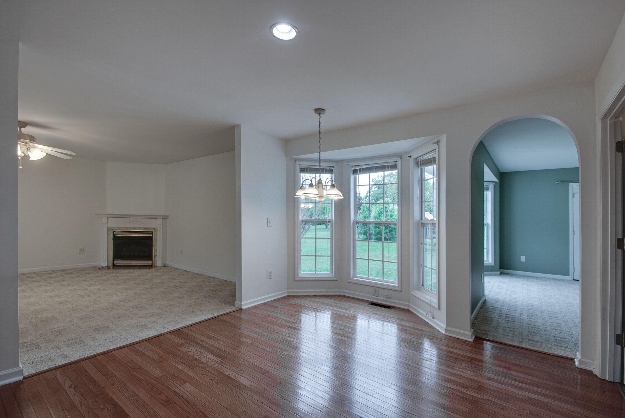 166 Caldwell Road Summertown, TN 38483 - Photo 19 of 36 an empty room with wooden floor and windows