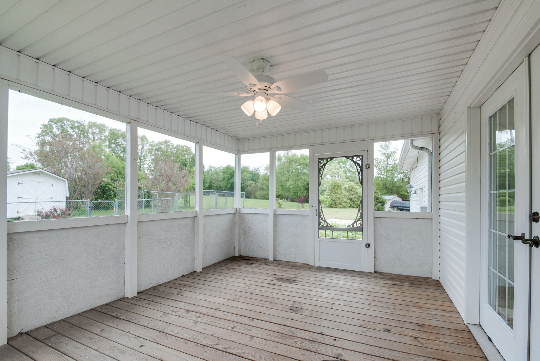 166 Caldwell Road Summertown, TN 38483 - Photo 28 of 36 a view of an empty room with a window and wooden floor
