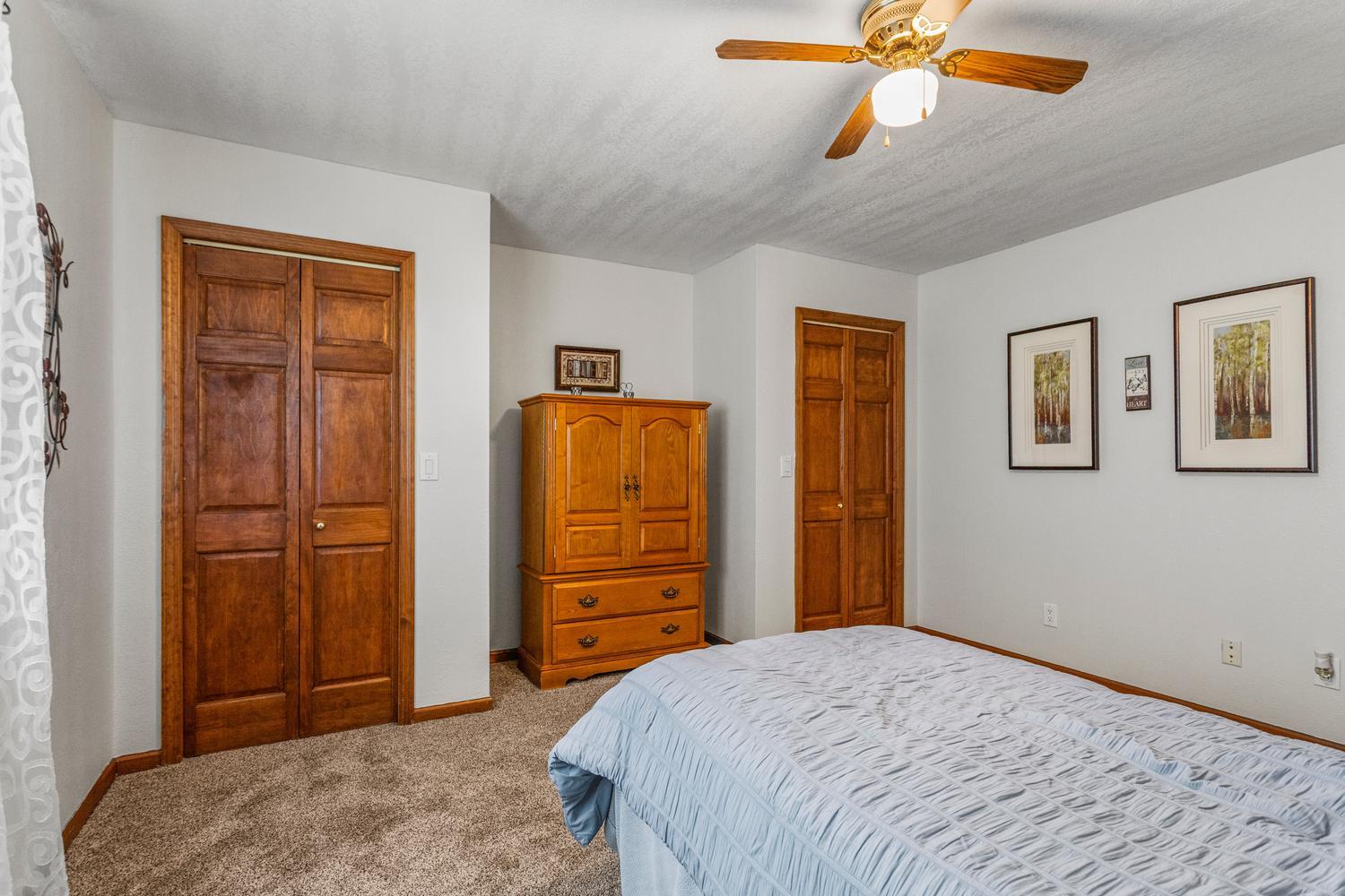 12317 North 1100 East Road Catlin, IL 61817 - Photo 32 of 44 a bedroom with a bed and a chandelier