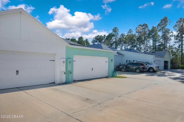 an aerial view of a house with swimming pool