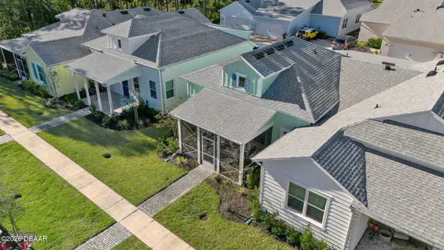 an aerial view of residential houses with outdoor space