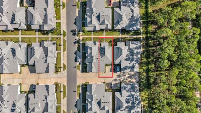 a view of a building with a cars park