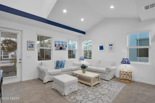 a living room with furniture and a table
