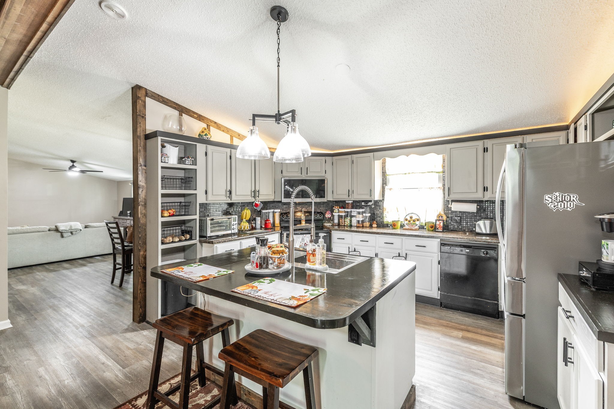 5776 Craft Road Joelton, TN 37080 - Photo 11 of 57 a kitchen with a table chairs refrigerator and cabinets