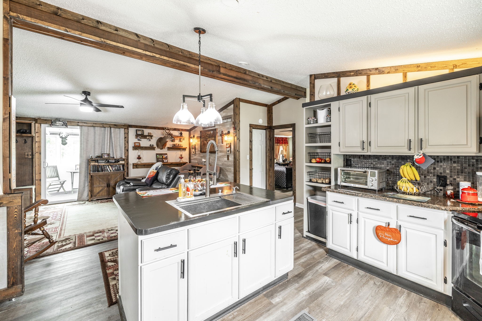 5776 Craft Road Joelton, TN 37080 - Photo 14 of 57 a kitchen that has a lot of cabinets and wooden floor