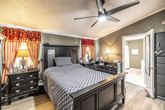 a bathroom with a double vanity sink a mirror and a shower