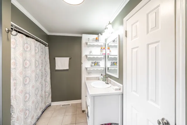 a bathroom with a toilet sink and tub