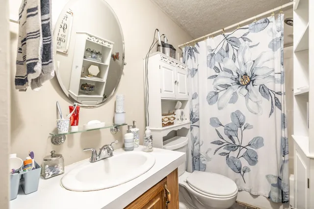 a view of an chairs and garden in the back yard