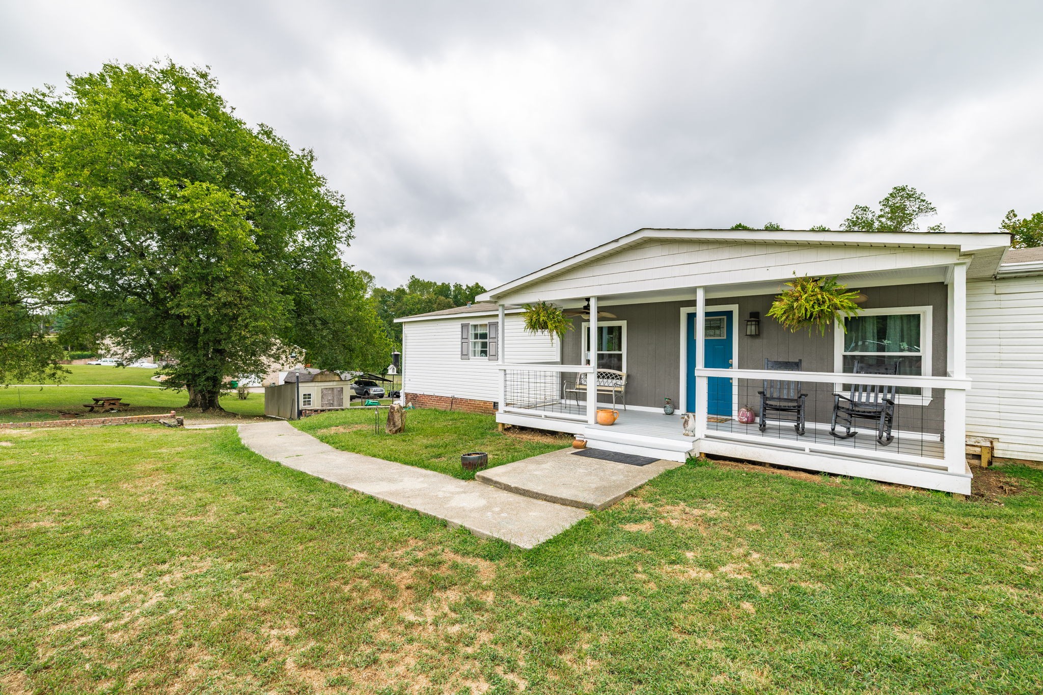 5776 Craft Road Joelton, TN 37080 - Photo 3 of 57 a front view of a house with a yard table and chairs