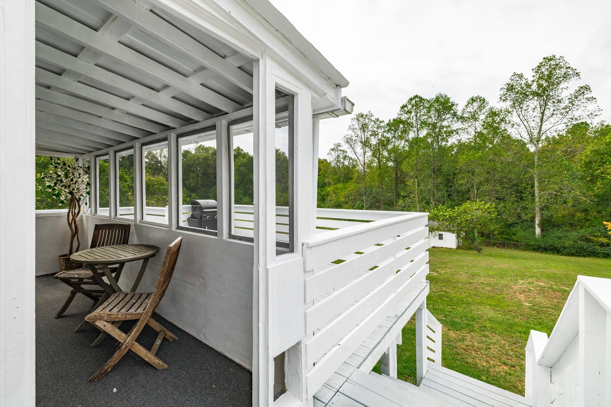 5776 Craft Road Joelton, TN 37080 - Photo 33 of 57 a view of an chairs and garden in the back yard
