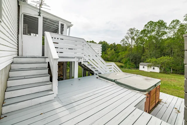 a view of a terrace with a garden and lake