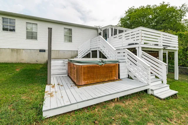a house with green field in front of it