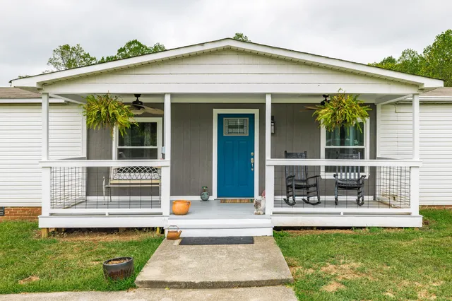 a front view of a house with swimming pool