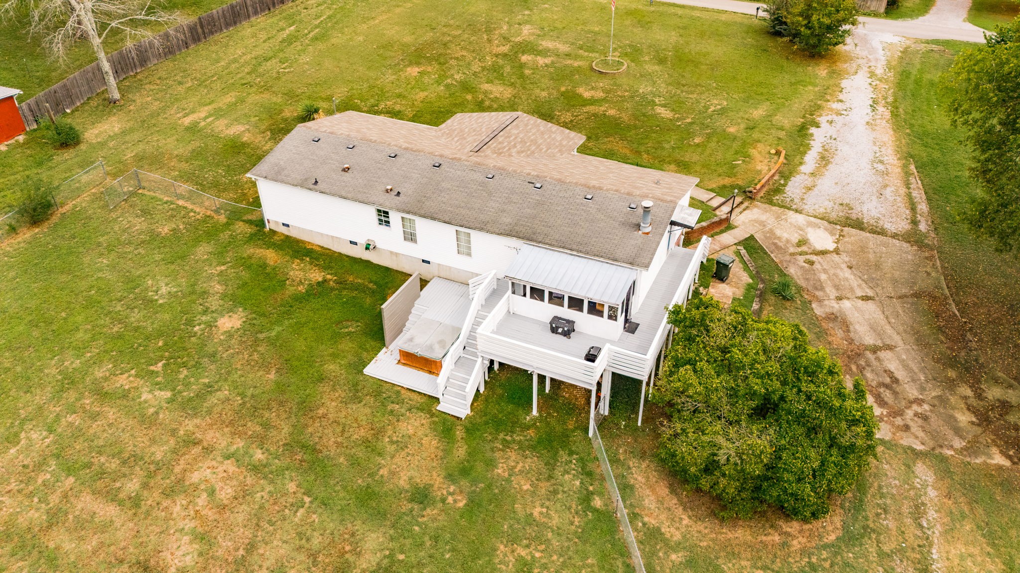 5776 Craft Road Joelton, TN 37080 - Photo 50 of 57 a white house with a yard and sitting area
