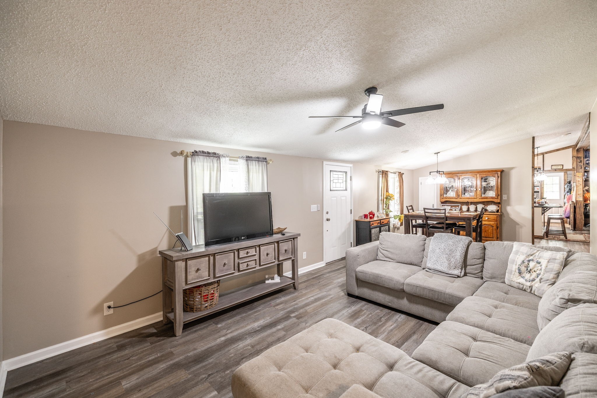 5776 Craft Road Joelton, TN 37080 - Photo 6 of 57 a living room with furniture and a flat screen tv