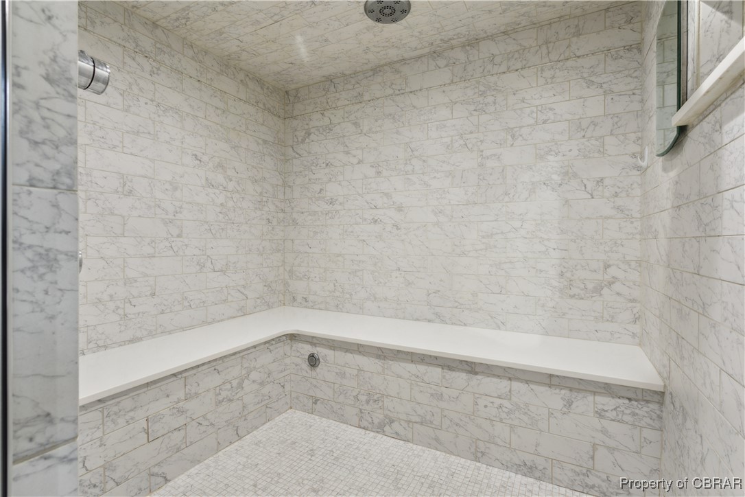 9300 Marlfield Road Gloucester, VA 23061 - Photo 37 of 50 Bathroom with tile walls and a tile shower