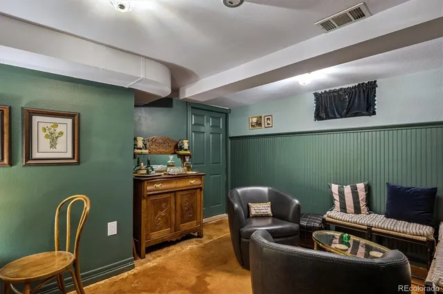 a living room with furniture and a chair