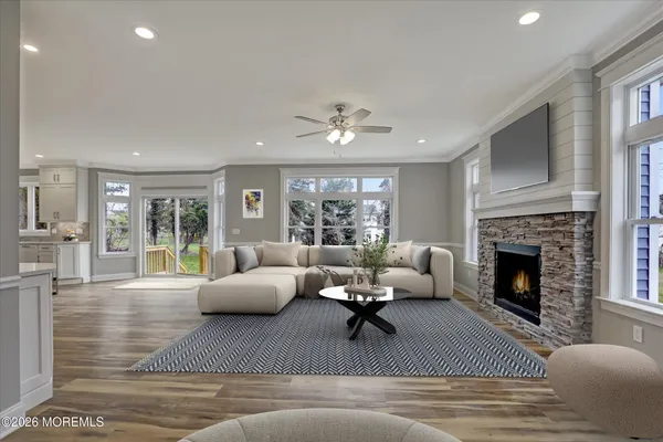 a living room with furniture fireplace and window