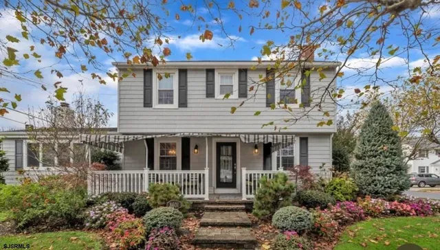 front view of a house with a garden