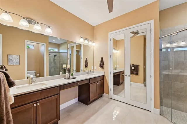 a bathroom with a double vanity sink mirror and double