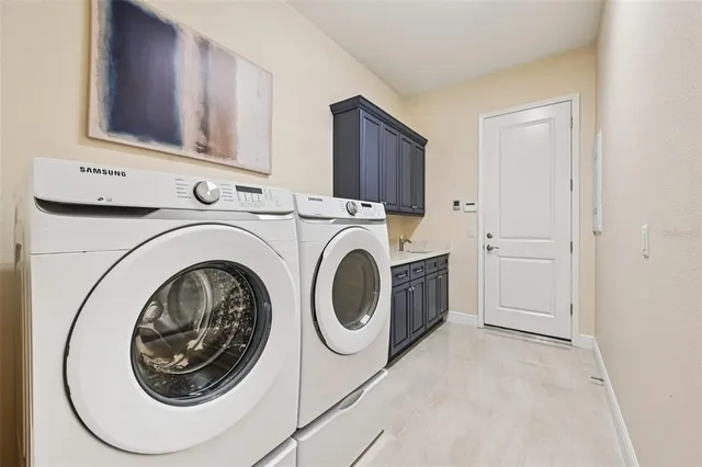a utility room with dryer and washer