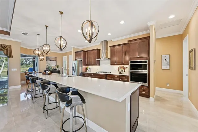 a large kitchen with a table and chairs in it