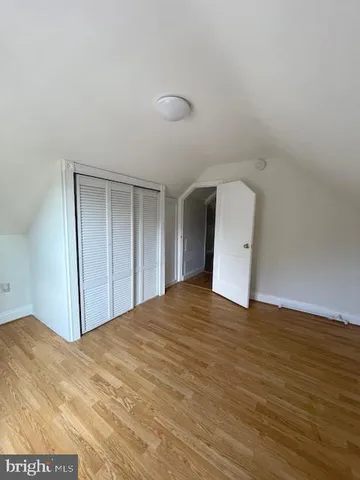a view of a refrigerator and window in a room