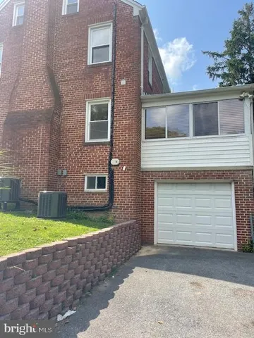a view of a big house with a big yard
