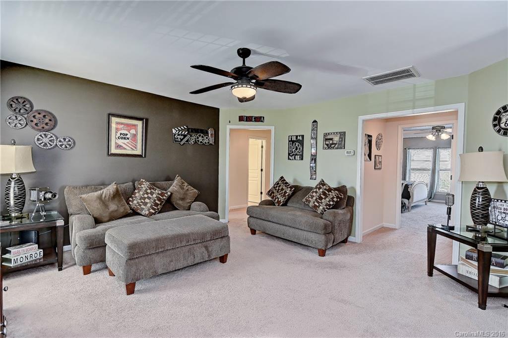 1428 Ridgehaven Road Waxhaw, NC 28173 - Photo 11 of 24 a living room with furniture and a ceiling fan
