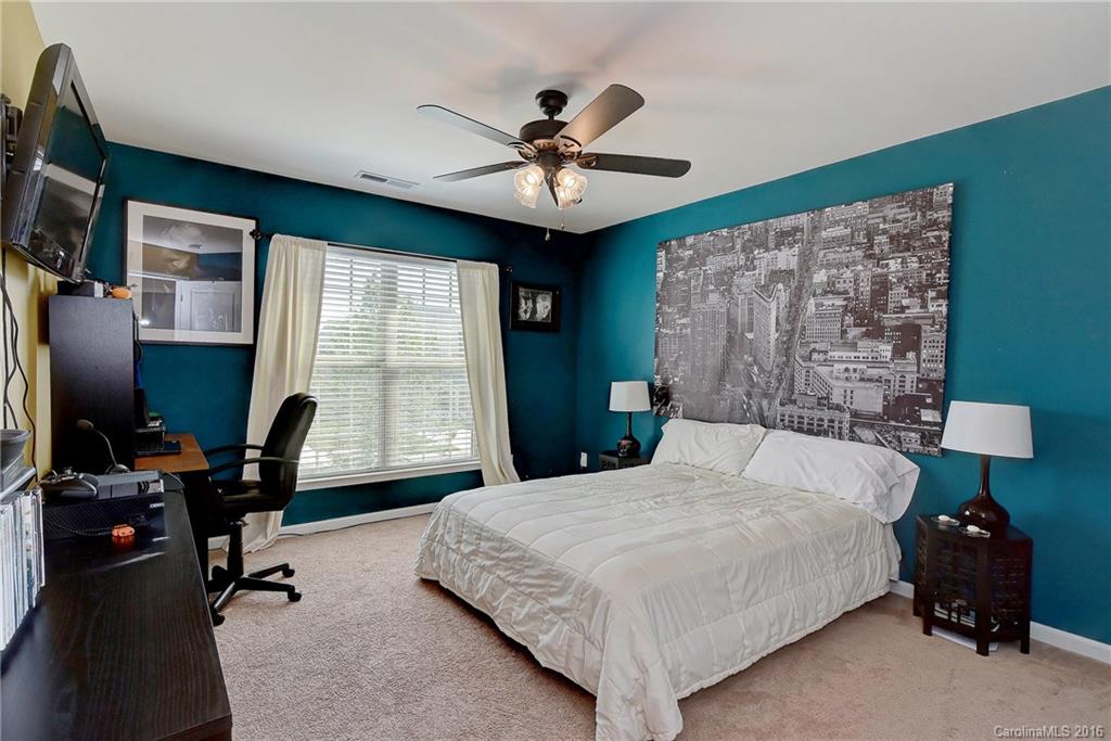1428 Ridgehaven Road Waxhaw, NC 28173 - Photo 18 of 24 a bedroom with a bed desk and a window