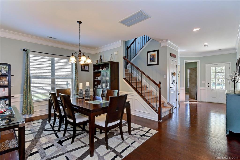 1428 Ridgehaven Road Waxhaw, NC 28173 - Photo 3 of 24 a view of a dining room with furniture window and wooden floor