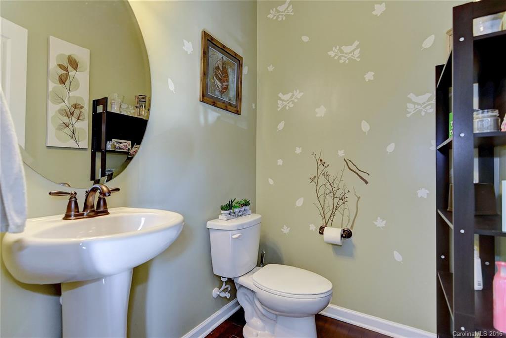 1428 Ridgehaven Road Waxhaw, NC 28173 - Photo 7 of 24 a bathroom with a toilet sink and mirror